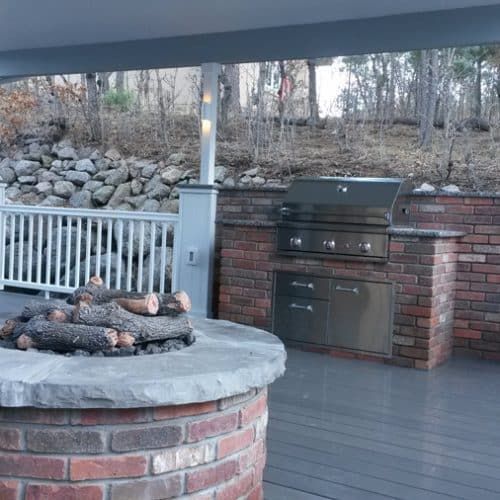Timbertech deck with patio cover, custom firepit, built-in grill, outdoor kitchen, Delta Heat BBQ grill, Broadmoor Bluffs