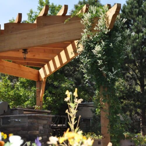 Cedar pergola with large timbers, outdoor kitchen, custom firepit, Broadmoor Bluffs